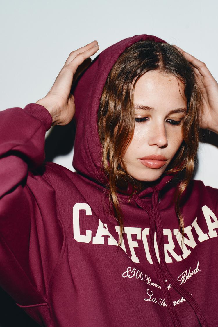 VARSITY SWEATSHIRT WITH RUFFLE TRIM