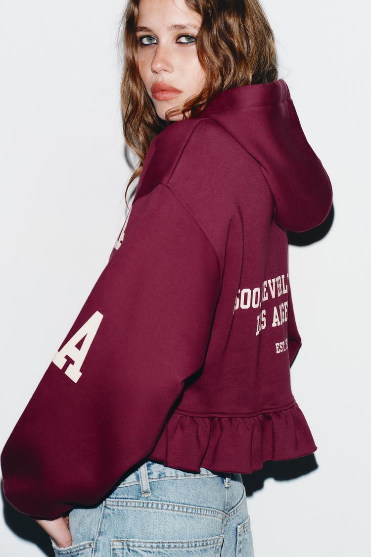 VARSITY SWEATSHIRT WITH RUFFLE TRIM